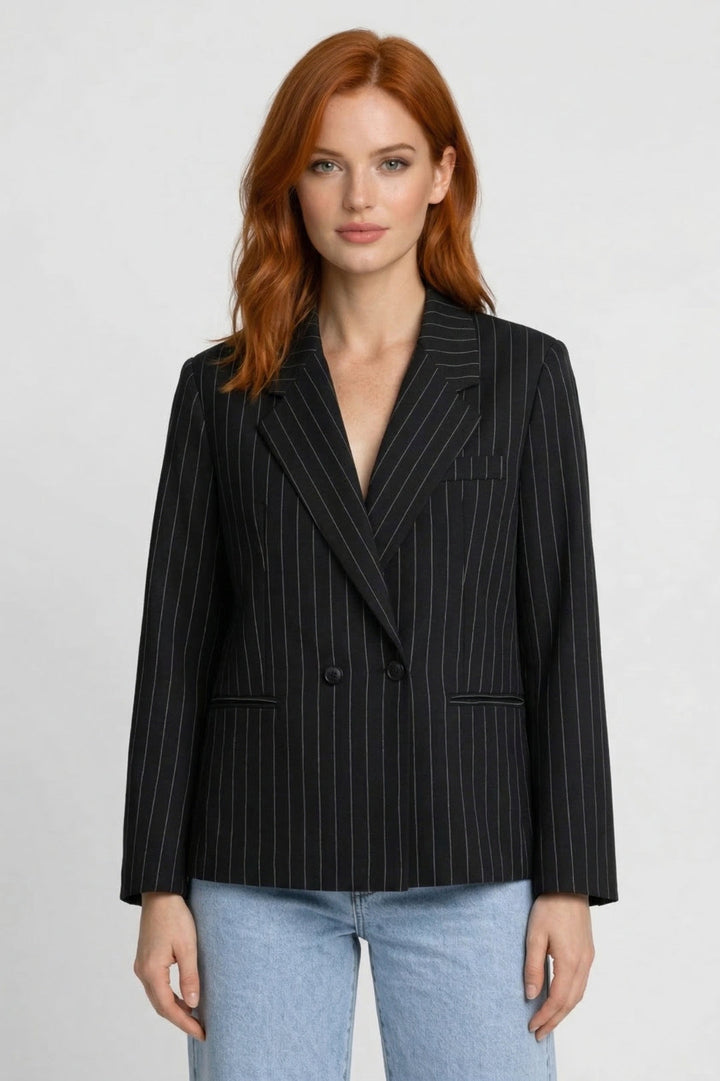 Chic women's oversized pinstripe blazer. Smart casual fashion jacket, perfect for elevating office wear & business style.