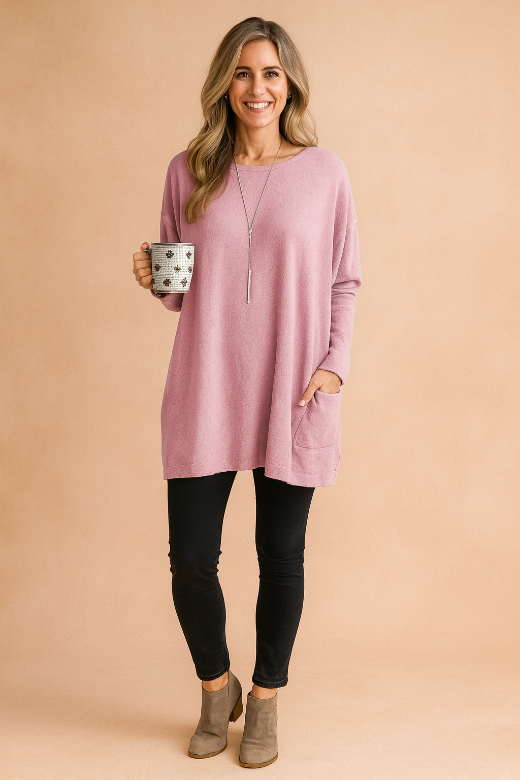 Long sleeve women's sweater with large front pocket, ideal for casual outfits.