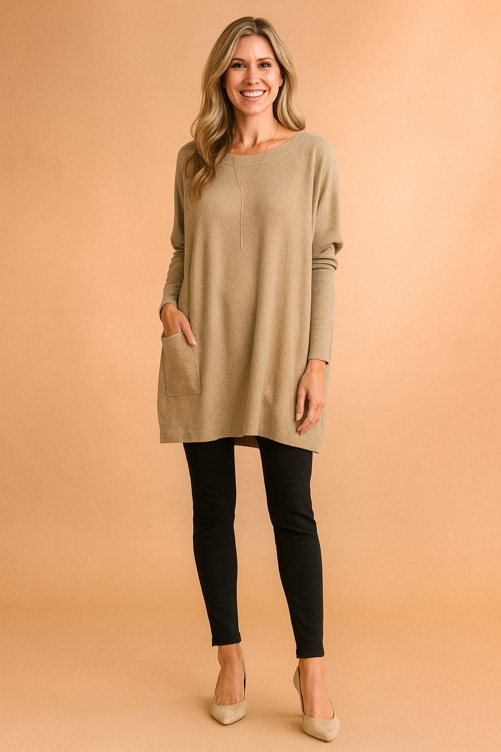 Comfortable oversized pullover sweater for women, featuring a stylish pocket detail.
