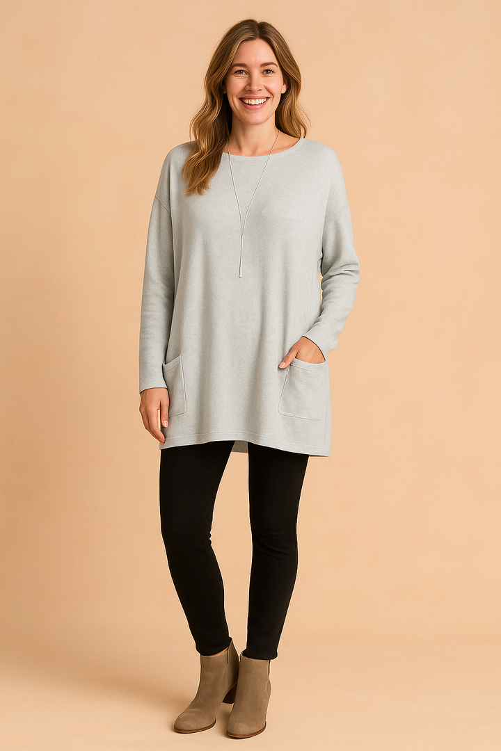 Oversized knit pullover for women, showcasing a trendy pocket and relaxed fit.