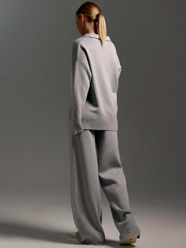 Fashionable women's two-piece lounge set: oversized polo & wide leg trousers for a chic, versatile look.