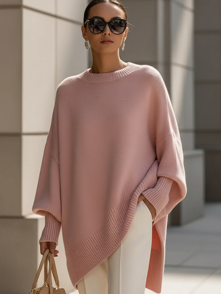 Relaxed fit women's poncho blouse with long sleeves & round neck. Versatile modern oversized top for women.