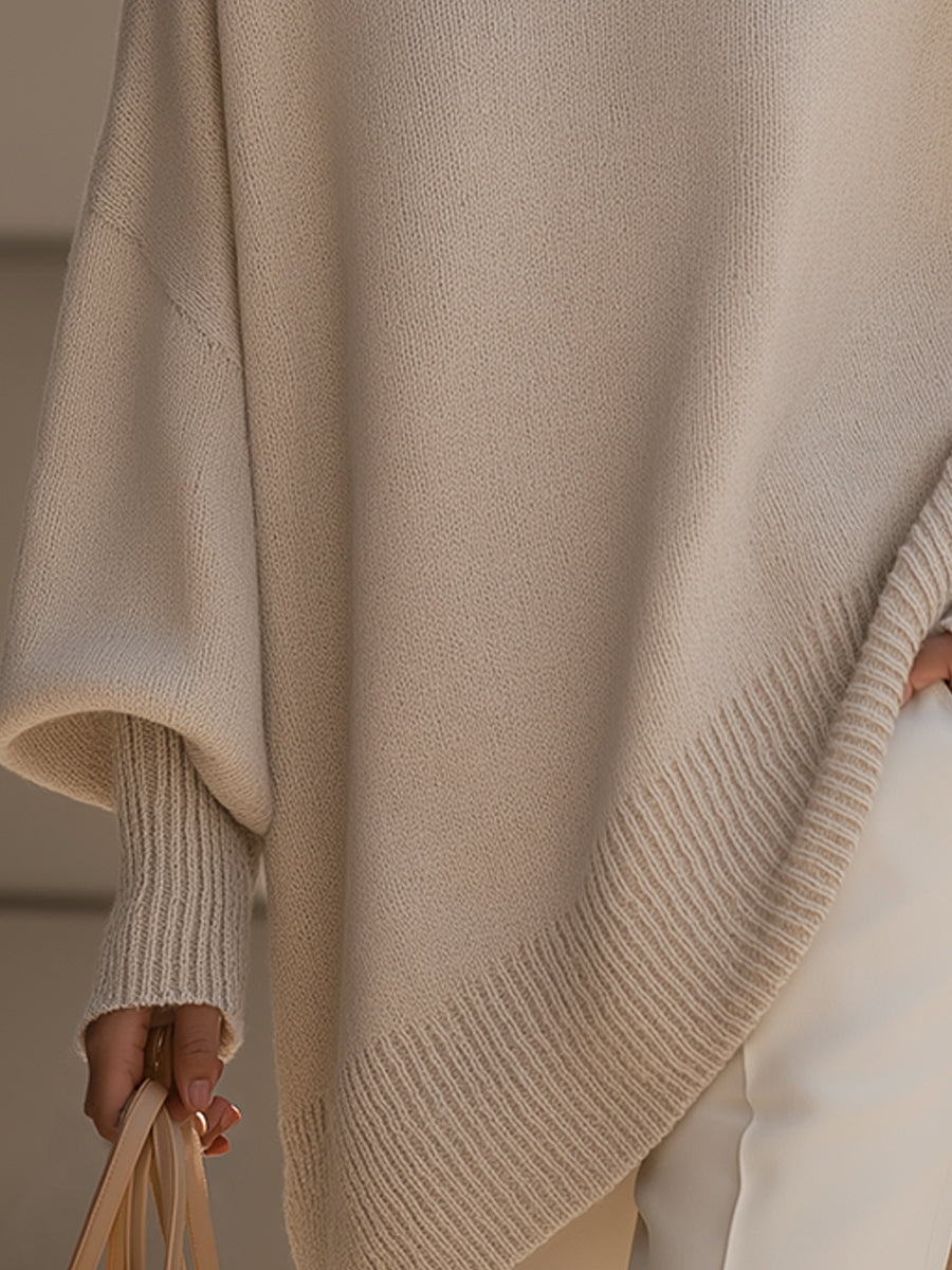 Effortless chic women's poncho blouse. Oversized, long sleeve, and relaxed fit for modern everyday style.