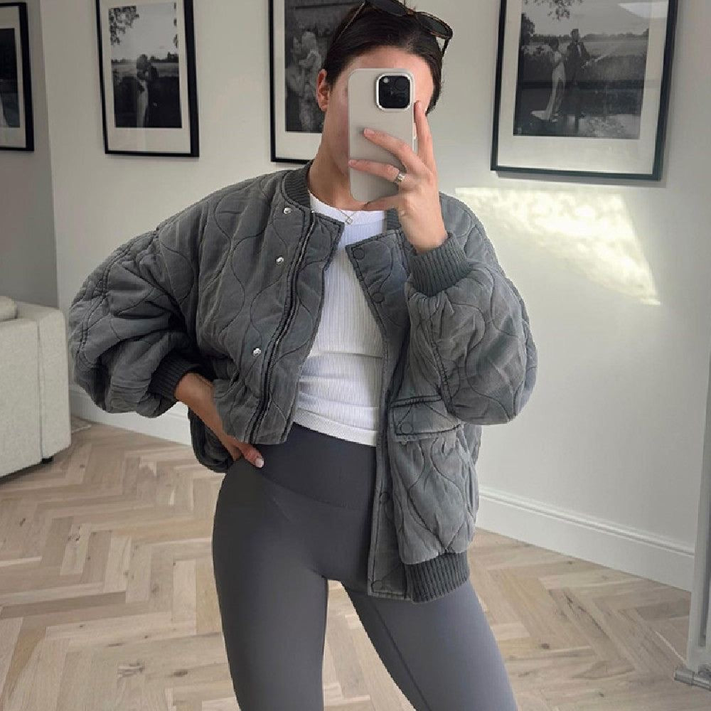 Modern women's bomber jacket with an oversized fit and quilted design, great for winter.