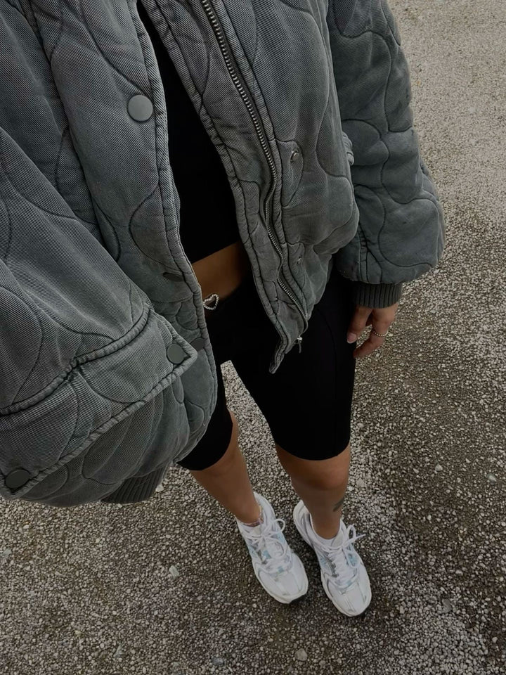 Chic oversized quilted bomber jacket for women, perfect as fall and winter outerwear.