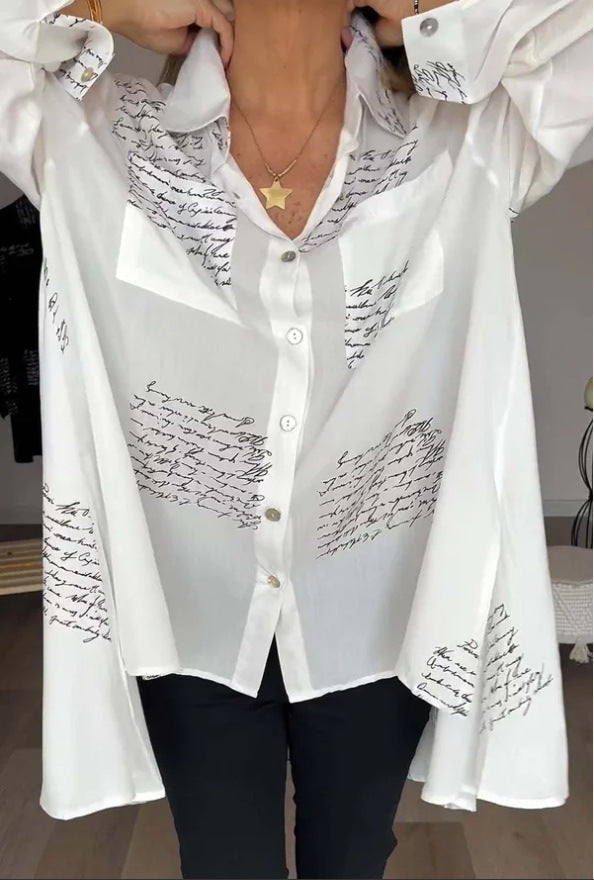Women's oversized script print button-up shirt. Chic, comfortable long sleeve top for versatile everyday wear.