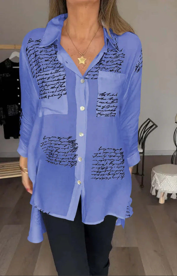 Close-up of women's oversized button-up shirt showing the unique script print detail. Versatile and stylish top.