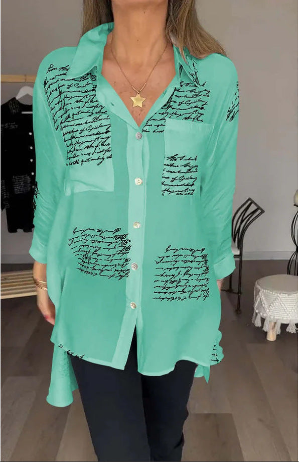 Relaxed fit women's oversized button-up shirt with a distinctive script print. Comfortable long sleeve top.