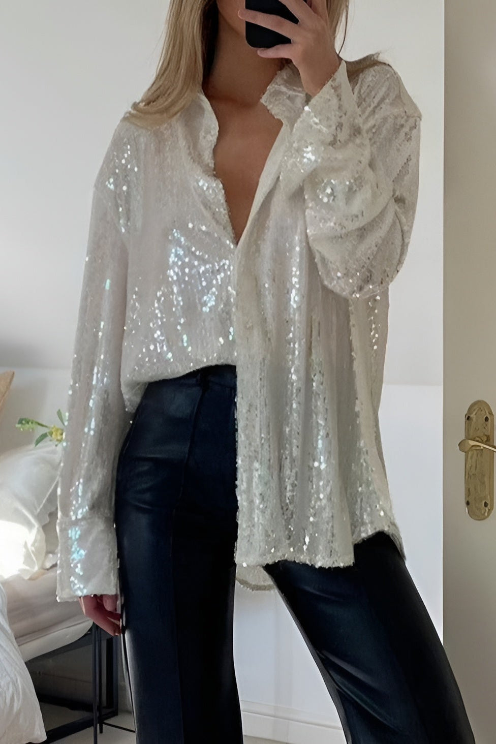 Women's oversized sequin shirt dress. Sparkly long sleeve mini dress with button-front closure for party wear.