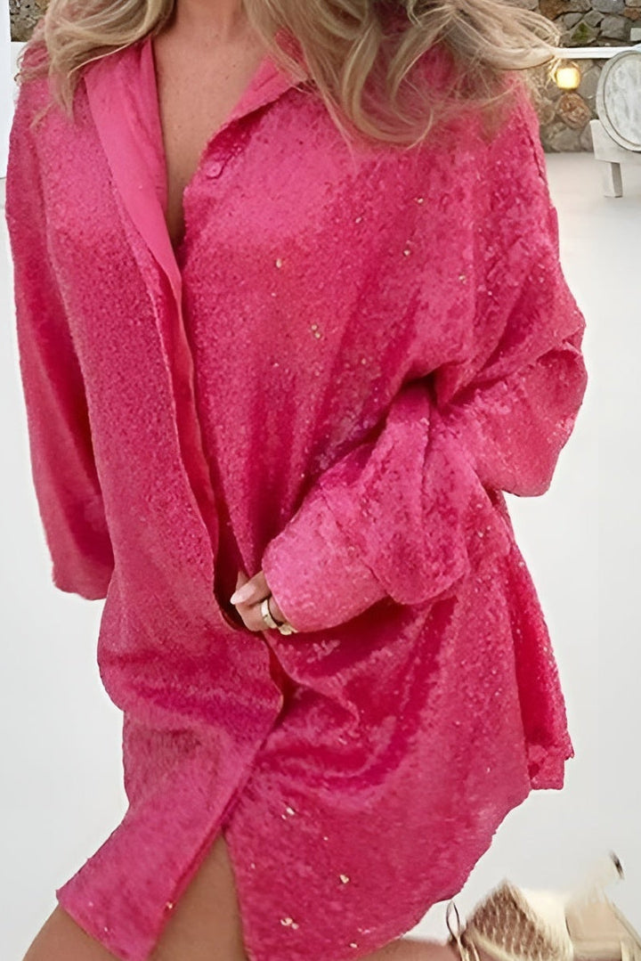 Elegant women's oversized sequin shirt dress. Long sleeve, button-front, sparkle mini dress for sophisticated evening wear.