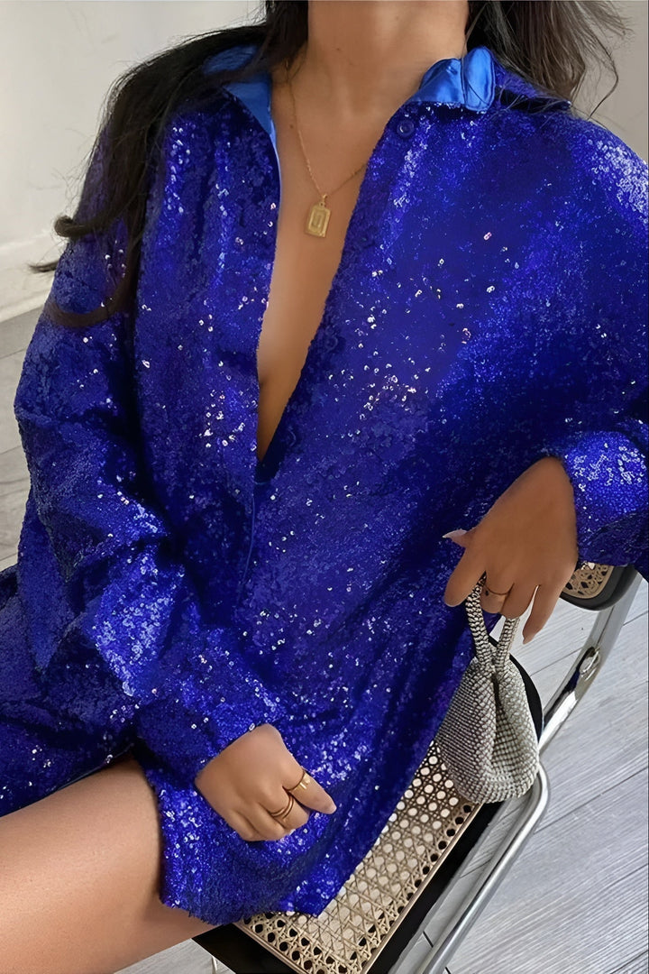 Fashionable women's oversized sequin mini dress. Sparkle long sleeve shirt dress featuring a chic button closure.