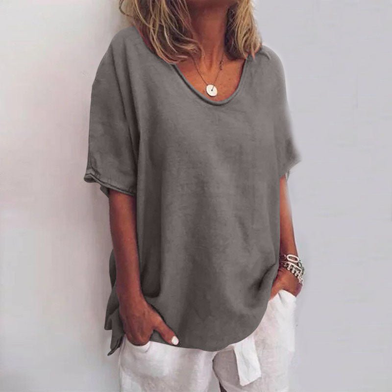 Women's oversized short sleeve V-neck blouse in a relaxed fit. Perfect for casual summer style and everyday comfort.