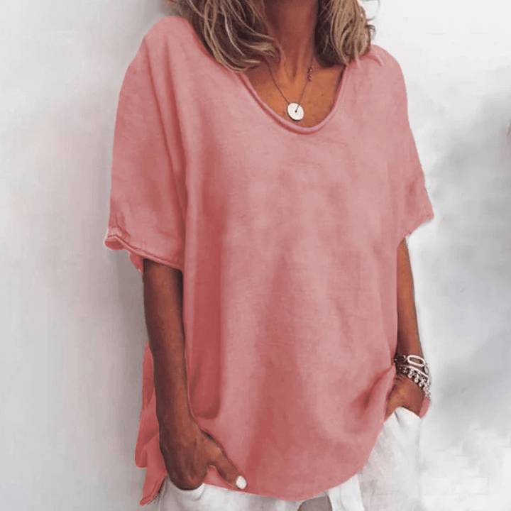 Comfortable women's oversized short sleeve blouse. V-neck, relaxed fit top for casual and effortless style.