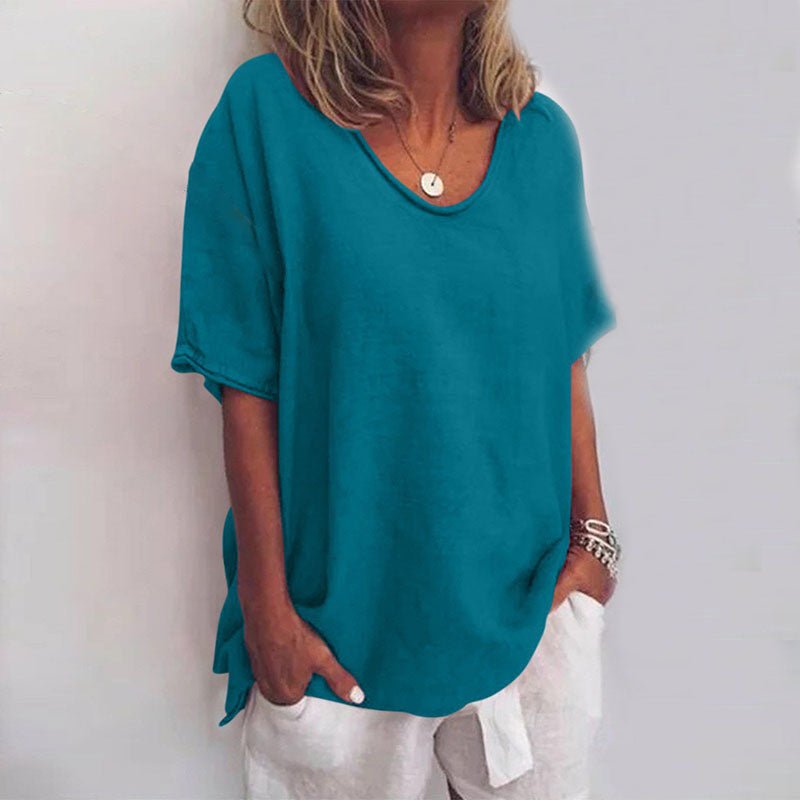 Relaxed fit women's oversized short sleeve blouse. V-neck design, perfect for comfortable and stylish summer wear.