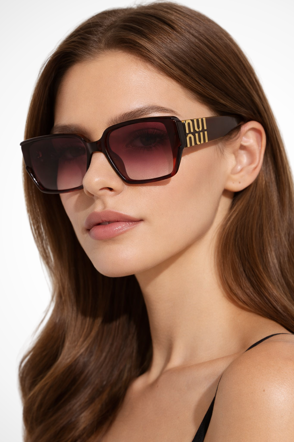 Fashionable women's oversized square sunglasses with striking gold detail. A modern accessory.