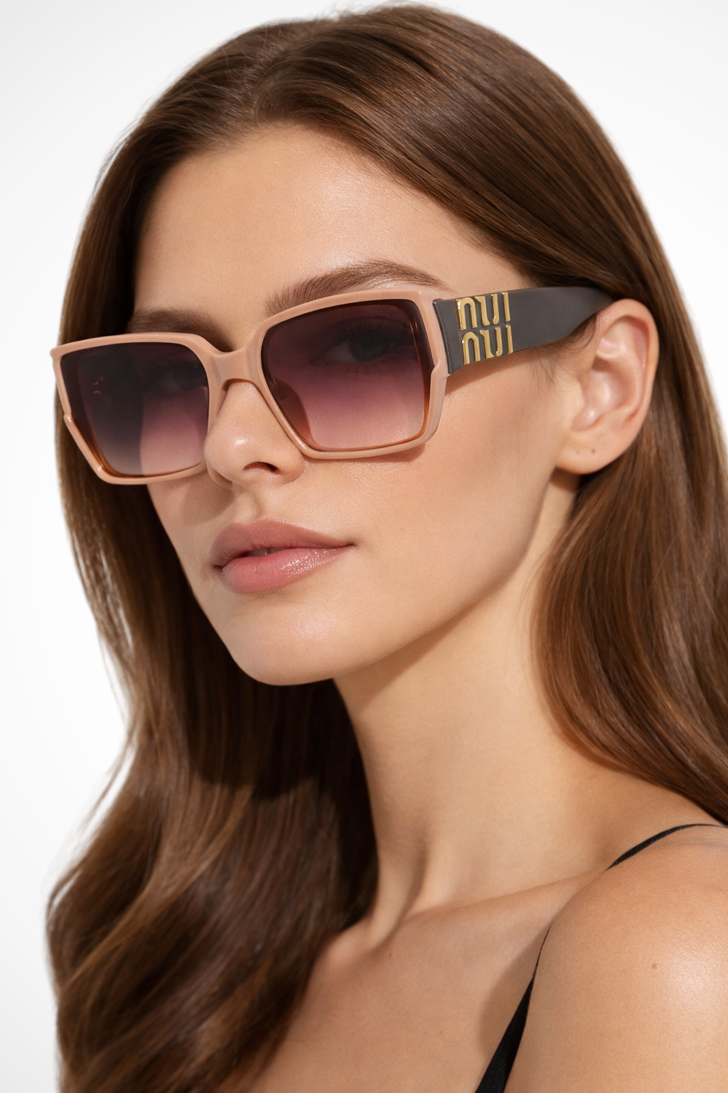 Women's oversized square frame sunglasses with sophisticated gold detail. Tinted fashion shades.