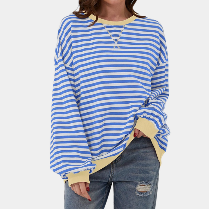 Casual women's oversized t-shirt with chic stripes & long sleeves. Comfortable, relaxed fit for everyday style.