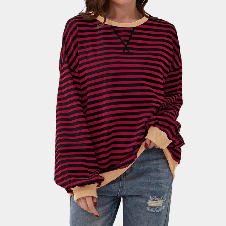 Relaxed fit women's oversized striped long sleeve top. A versatile casual t-shirt for comfortable everyday wear.
