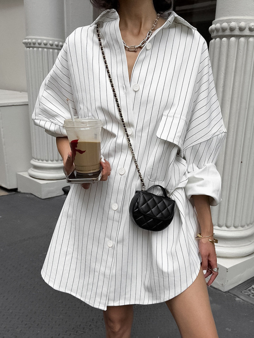 Women's oversized striped shirt dress for effortless chic style, featuring a relaxed fit and button-down design.