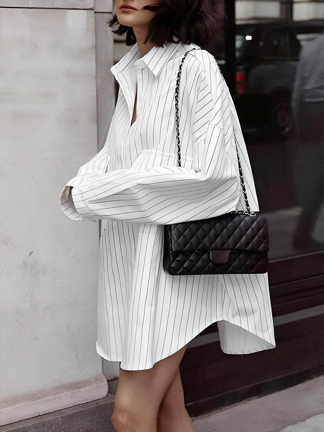 Relaxed fit long-sleeve striped shirt dress for women, a modern button-down style ideal for casual chic fashion.