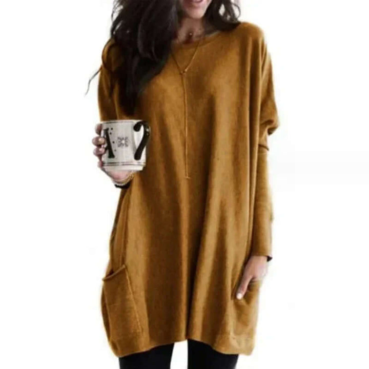 Stylish plus size tunic sweater, offering cozy warmth and an elegant, comfortable fit.