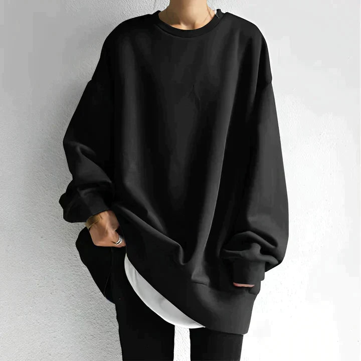 Women's oversized tunic sweater in a cozy, relaxed fit. Features long sleeves & crewneck, perfect for fall/winter.