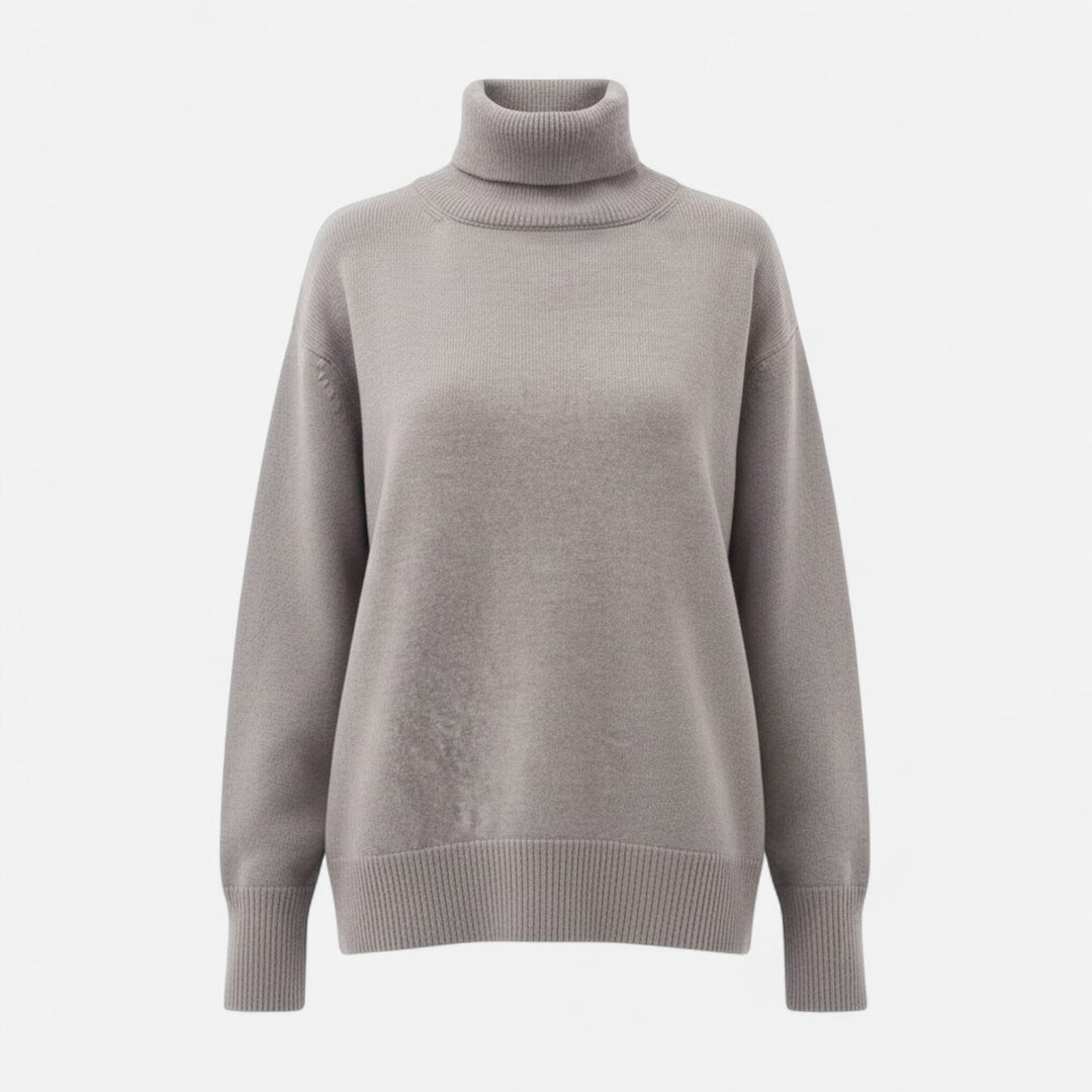 Women's oversized turtleneck knit sweater in beige, perfect for winter fashion.