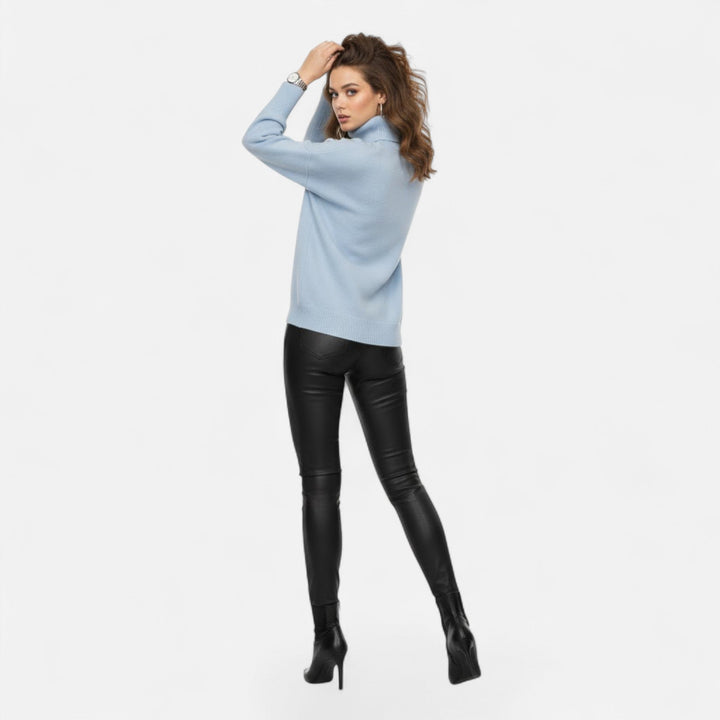 Oversized turtleneck sweater for women, showcasing its thick yarn and warmth.
