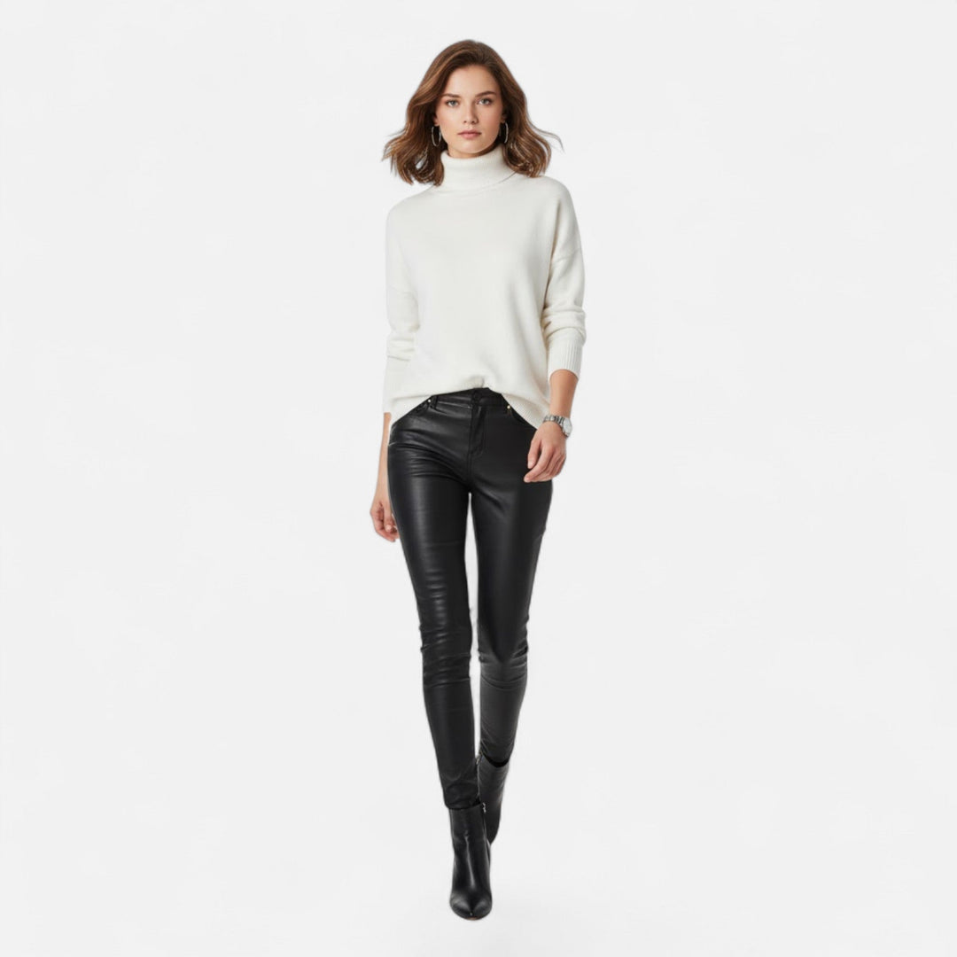 Winter fashion essential: a warm, long sleeve turtleneck knit sweater for ladies.