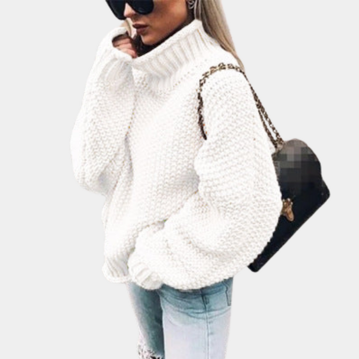 Women's oversized turtleneck sweater in a cozy knit. Perfect for chic winter fashion and comfortable cold weather layering.