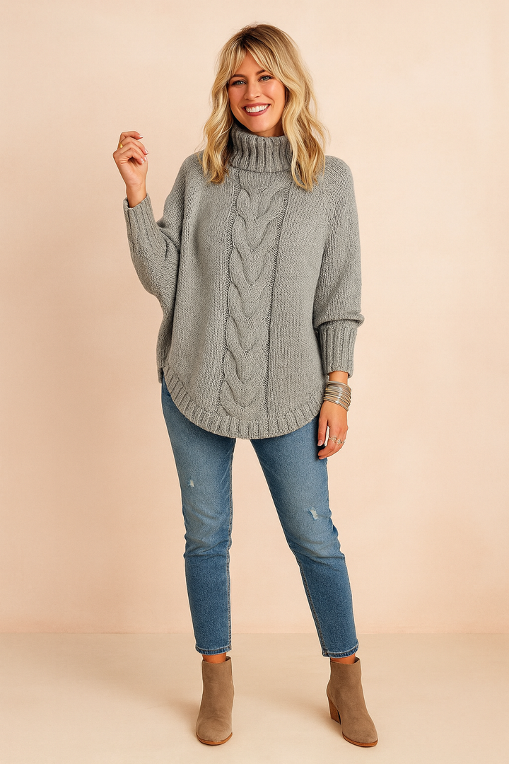 Close-up: Cozy knit women's oversized turtleneck sweater, highlighting warm texture for fall & winter style and comfort.