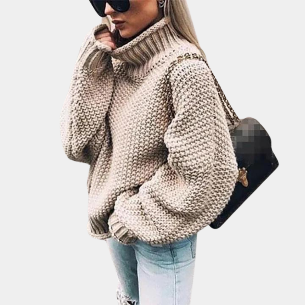Relaxed fit women's long sleeve turtleneck sweater. Comfortable and versatile for everyday chic winter fashion.