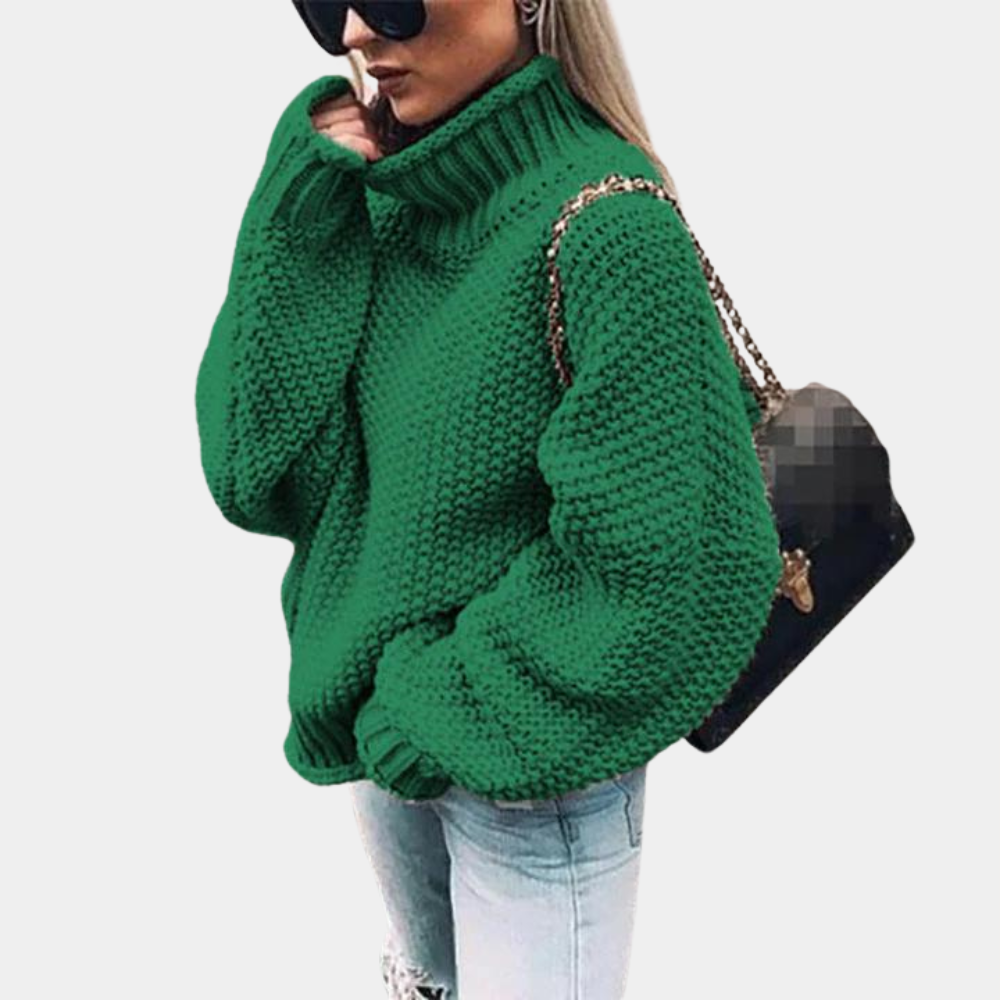 Women's chunky knit oversized turtleneck sweater. Ideal for warm layering and chic winter fashion outfits.