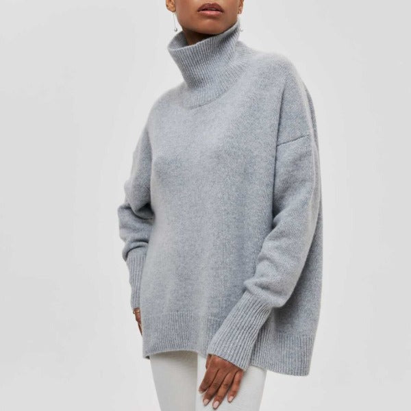 Cozy women's oversized turtleneck jumper. A comfortable long sleeve sweater for winter fashion.