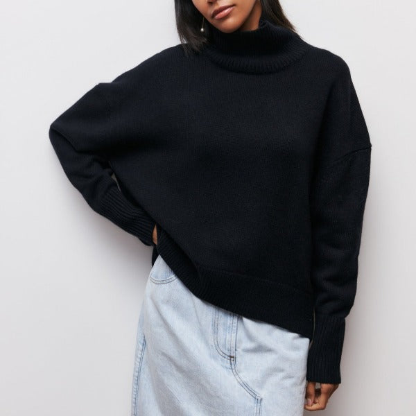 Stylish women's oversized turtleneck sweater. Versatile knit jumper for casual or elegant fall style.