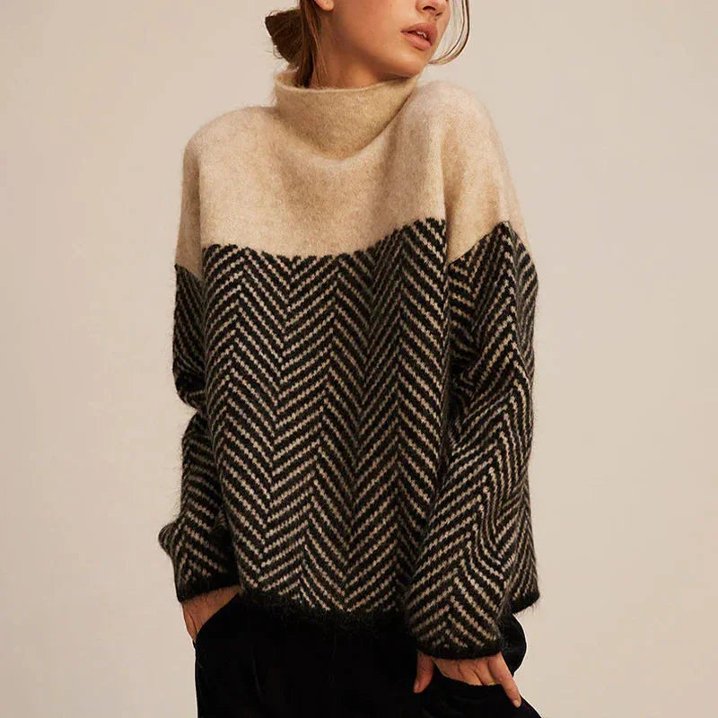Women's oversized turtleneck sweater with a stylish chevron pattern, perfect for cozy fall & winter fashion.