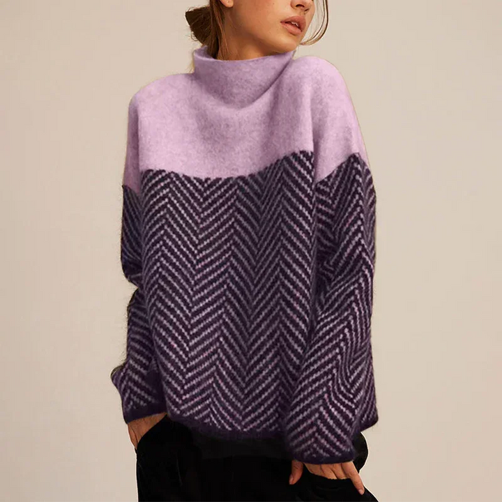 Elegant women's oversized long-sleeve turtleneck sweater with a trendy chevron pattern, ideal for fall and winter style.