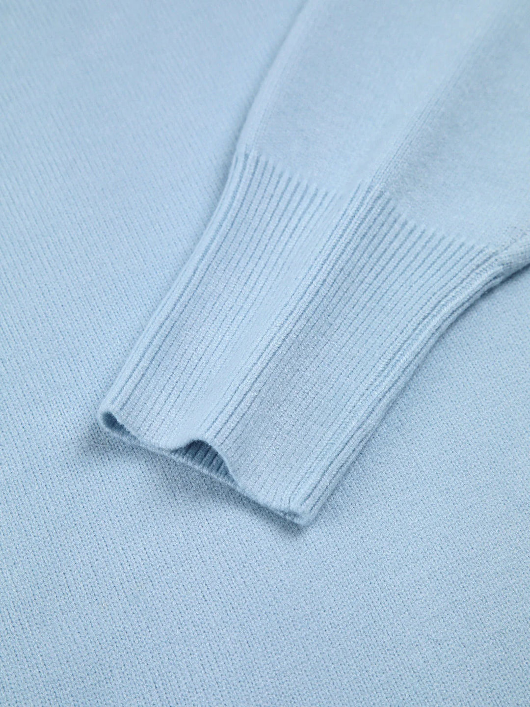 Fashionable women's oversized turtleneck sweater, perfect winter clothing with unique elbow slits.