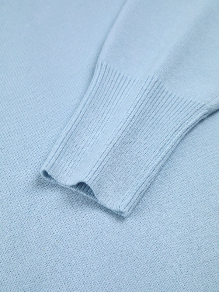 Fashionable women's oversized turtleneck sweater, perfect winter clothing with unique elbow slits.