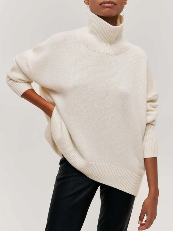 Casual long sleeve ladies sweater; an oversized turtleneck with chic elbow slits, great for fall/winter.