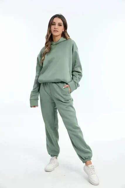 Women's fashion oversized tracksuit set. Cozy two-piece loungewear for fall and winter styles, casual outfit.