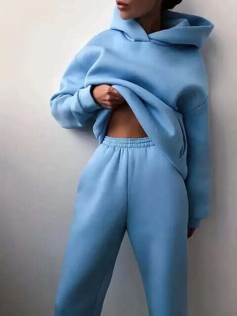 Modern women's oversized two-piece tracksuit. Chic and comfortable sporty fashion for women's casual wear.
