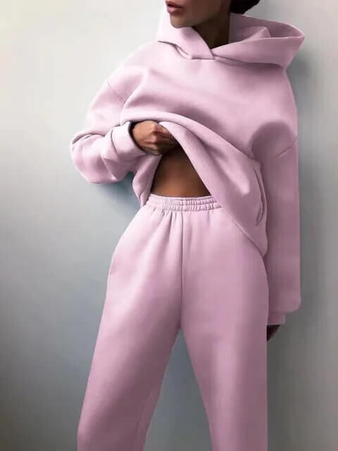 Women's comfy activewear & loungewear set. Oversized two-piece tracksuit with hoodie and joggers for fall.