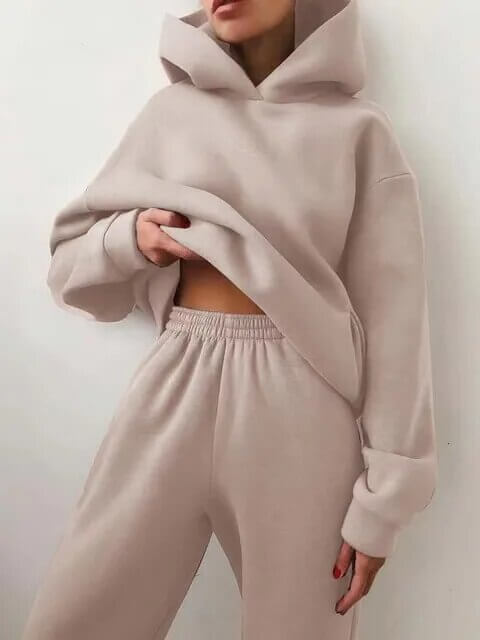 Women's relaxed fit joggers with a matching oversized hoodie. Ideal two-piece loungewear set for comfort.