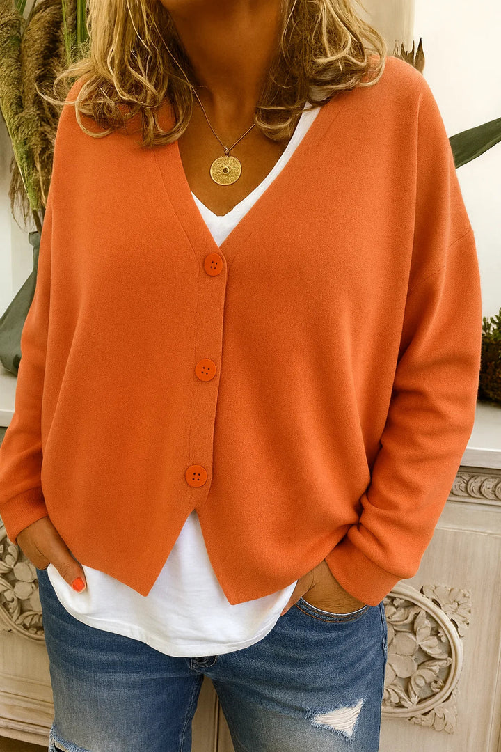 Women's oversized V-neck cardigan sweater with button front, perfect for stylish layering & fall fashion.
