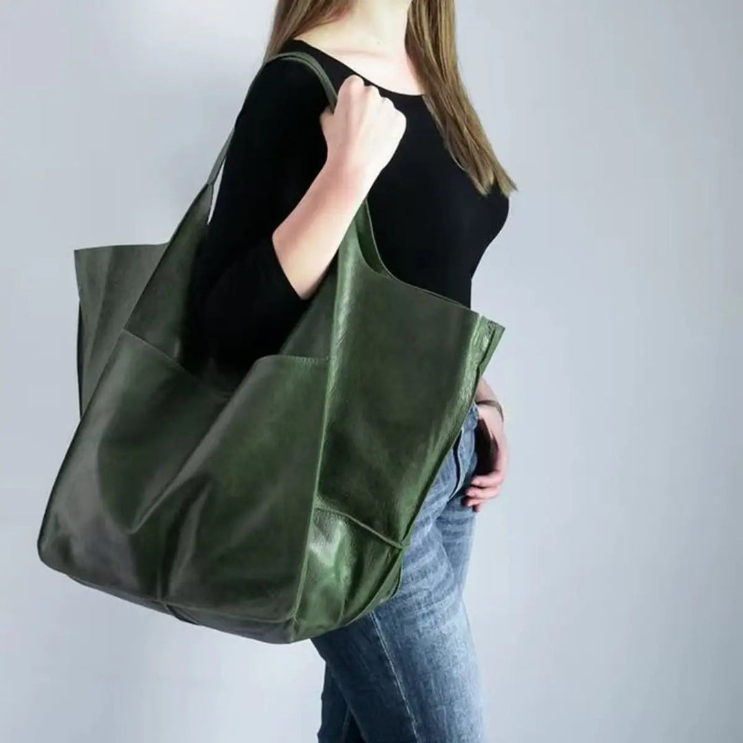 Women's oversized vegan leather tote bag, perfect for everyday carry & work.