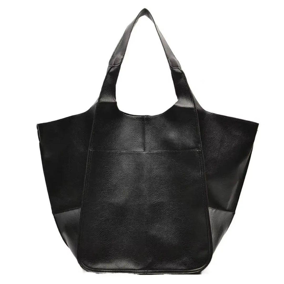 Sleek oversized vegan leather tote bag, designed for the modern woman.