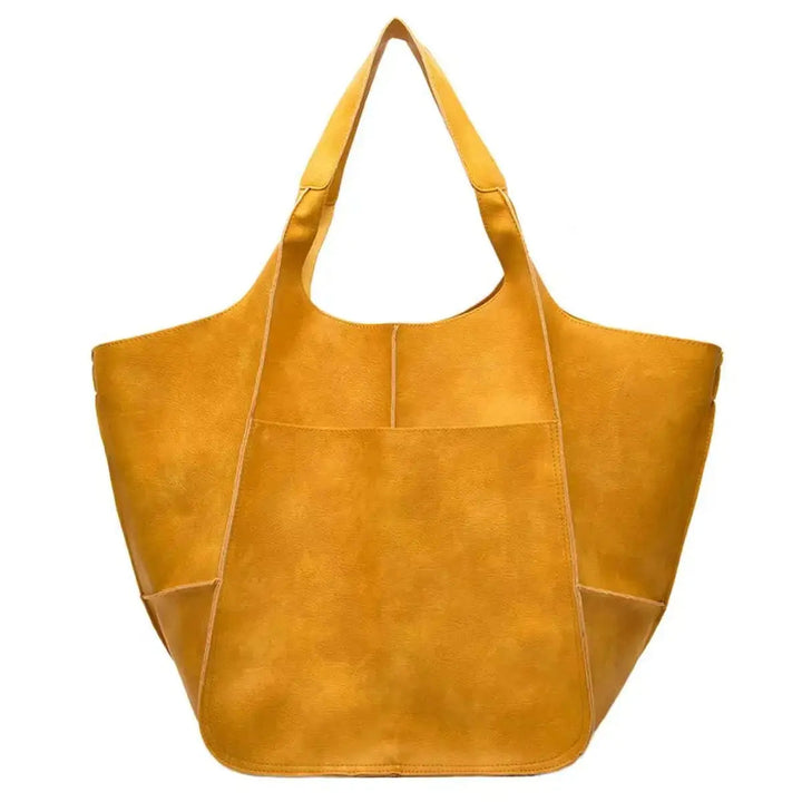 Spacious women's oversized tote, a durable vegan leather shoulder bag.