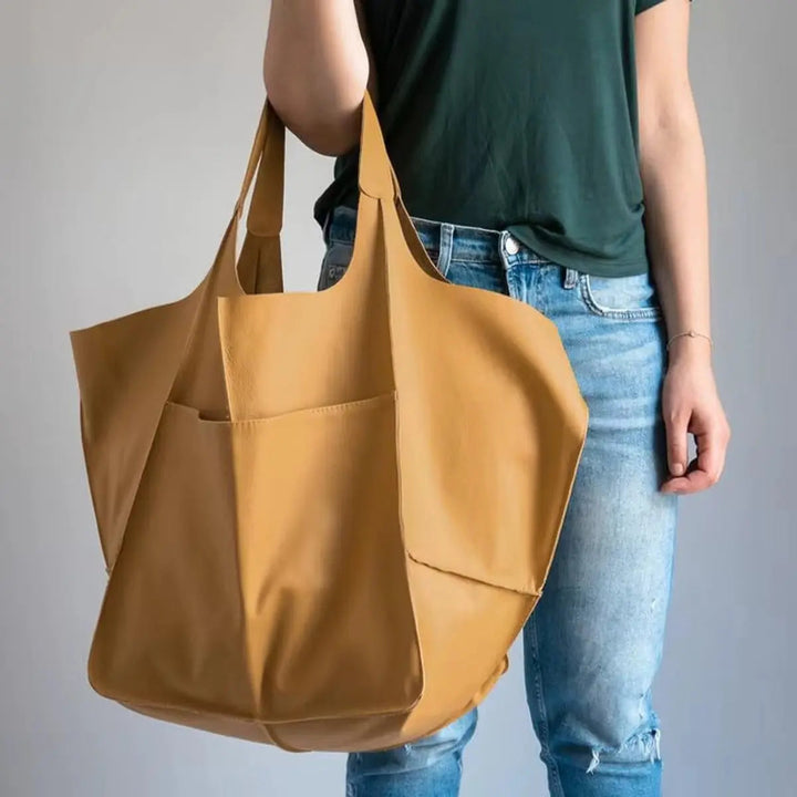 Trendy vegan leather tote bag for women, an essential oversized fashion accessory.