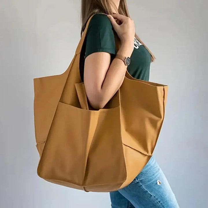 Chic oversized tote bag for women, made from durable vegan leather.